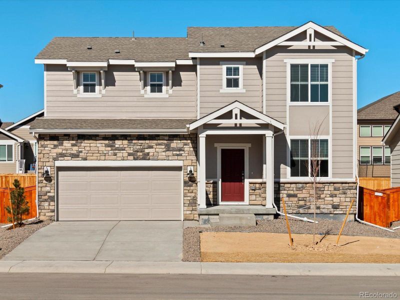 Front exterior of a new home in Hidden Valley Farm, Severance, CO, highlighting curb appeal (Image 2). Front exterior of a new home in Hidden Valley Farm, Severance, CO, highlighting curb appeal (Image 2).
