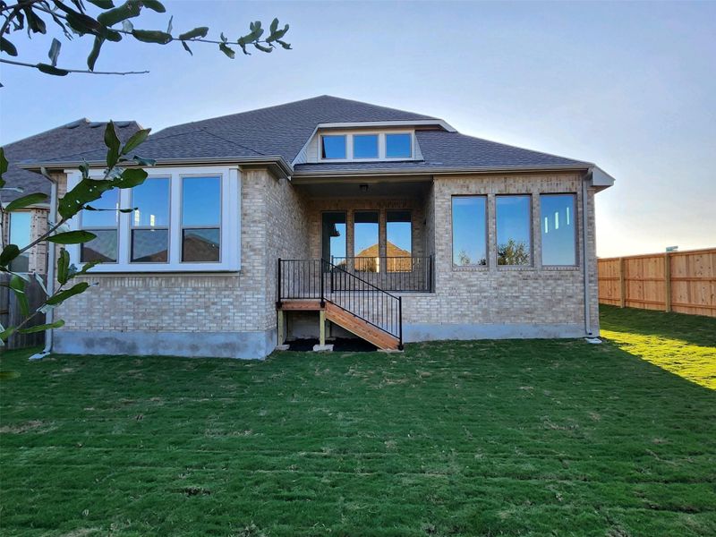 Rear of Home With Covered Patio