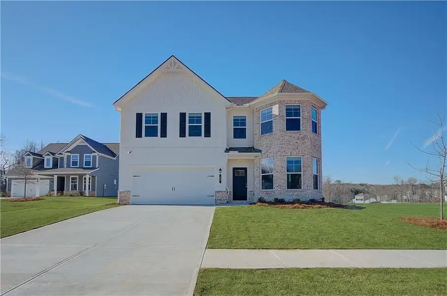 Front exterior of a new home in Chapel Hill, Newnan, GA, highlighting curb appeal (Image 2). Front exterior of a new home in Chapel Hill, Newnan, GA, highlighting curb appeal (Image 2).