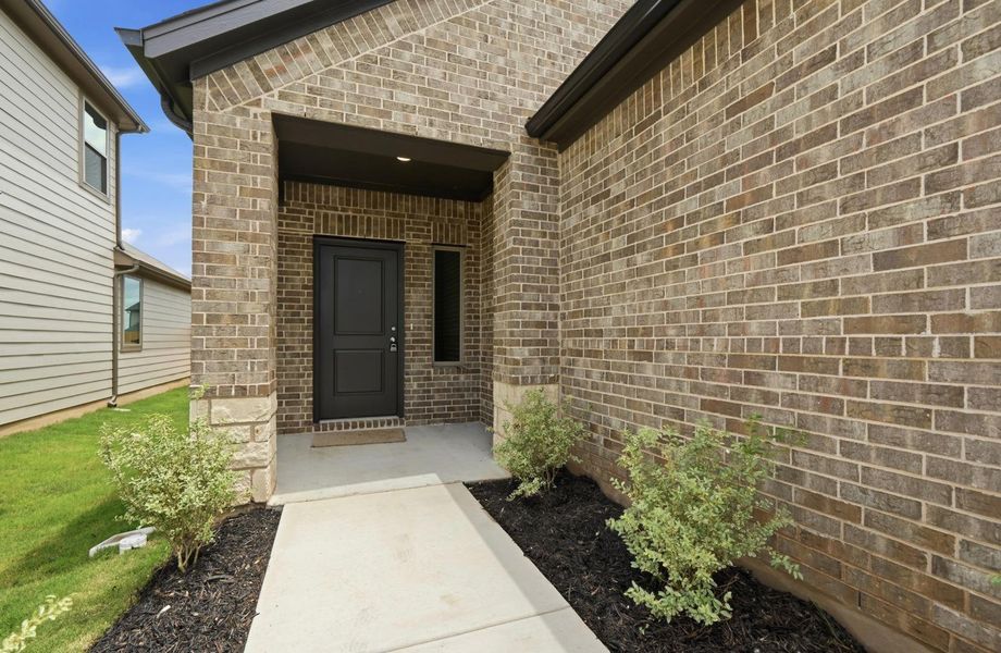 Exterior details and patio area of a home in Trinity Ranch, Elgin (Image 3).
