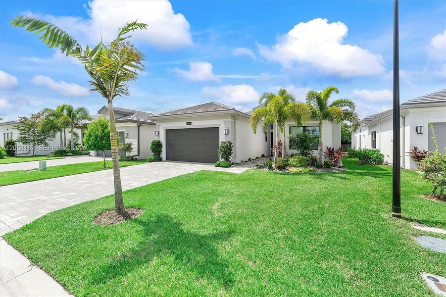 Front exterior of a new home in , Boynton Beach, FL, highlighting curb appeal (Image 1). Front exterior of a new home in , Boynton Beach, FL, highlighting curb appeal (Image 1).