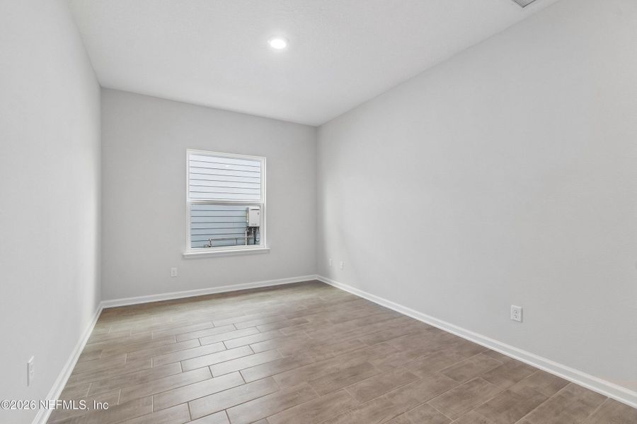Spacious, unfurnished interior of a new home in Tributary 50', Yulee (Image 24).