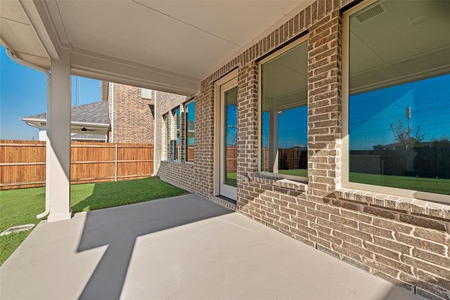 Exterior details and patio area of a home in Walden Pond, Forney (Image 4).
