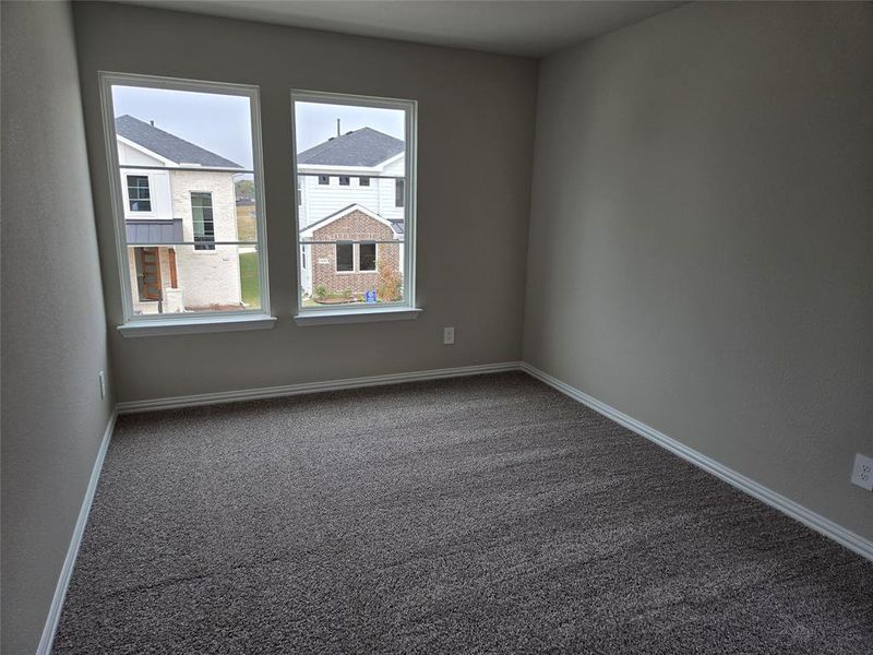 Unfurnished room featuring carpet and baseboards Unfurnished room featuring carpet and baseboards