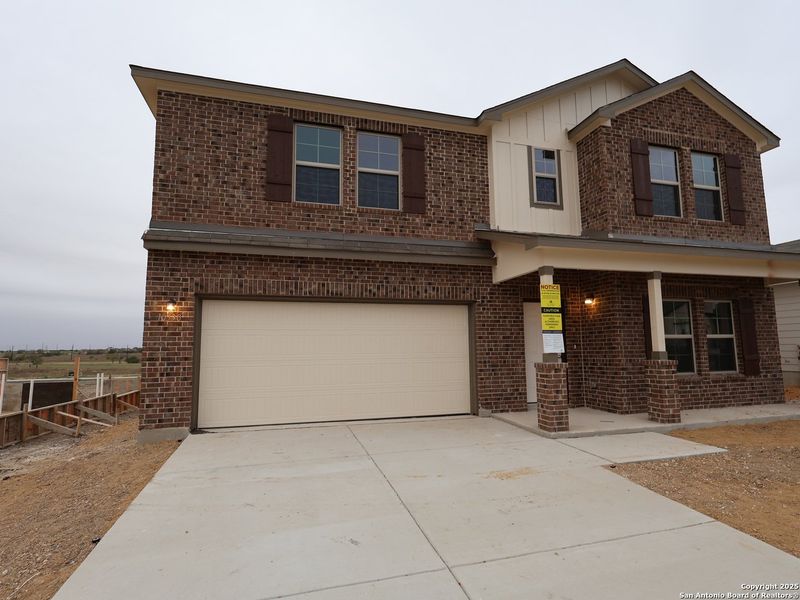 Front exterior of a new home in Paloma Park, Converse, TX, highlighting curb appeal (Image 1). Front exterior of a new home in Paloma Park, Converse, TX, highlighting curb appeal (Image 1).