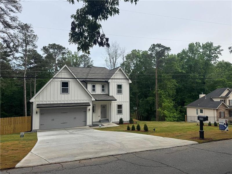 Front exterior of a new home in , Mableton, GA, highlighting curb appeal (Image 14).