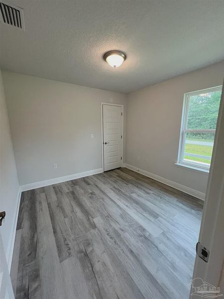 Spacious, unfurnished interior of a new home in Pine Top, Cantonment (Image 7).