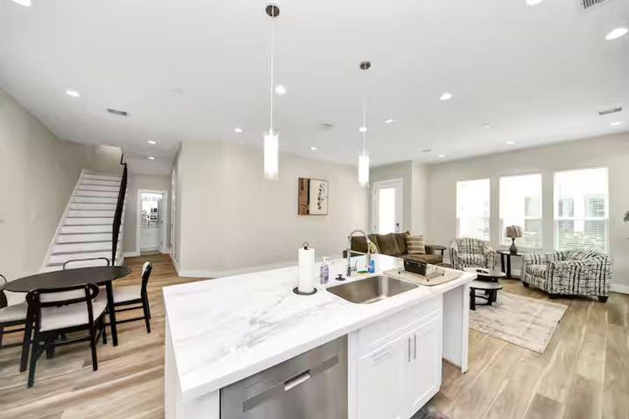 This angle shows just how much usable space the first floor offers, with the kitchen, dining, and living areas all working together.