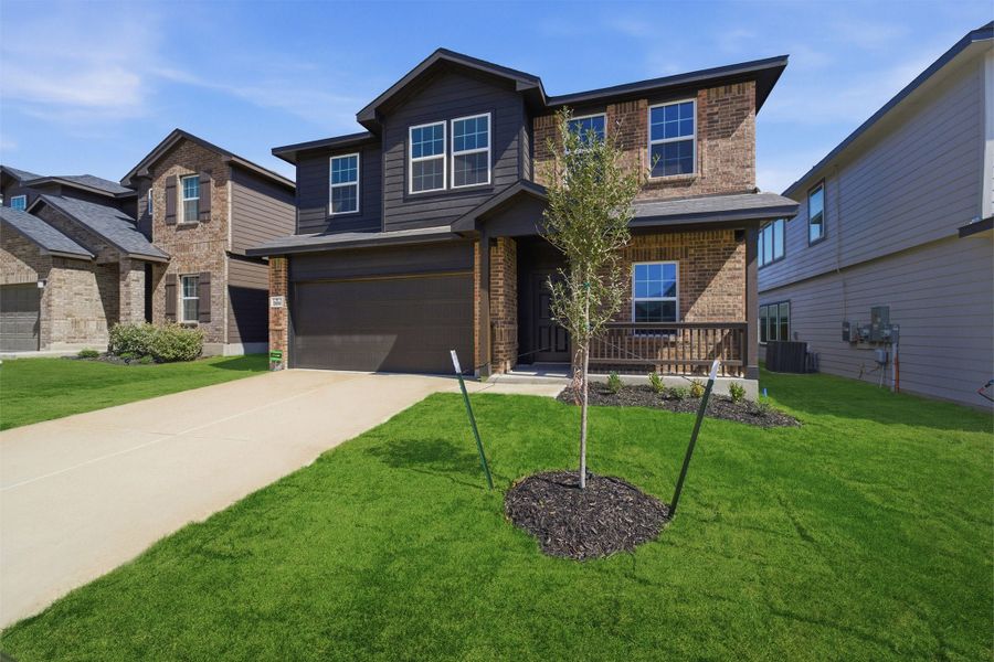 Front exterior of a new home in Laurel Vistas, San Antonio, TX, highlighting curb appeal (Image 2).