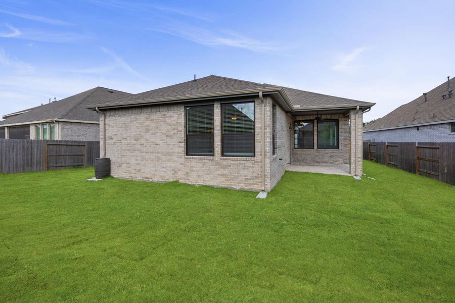 Exterior details and patio area of a home in Artavia, Conroe (Image 4).