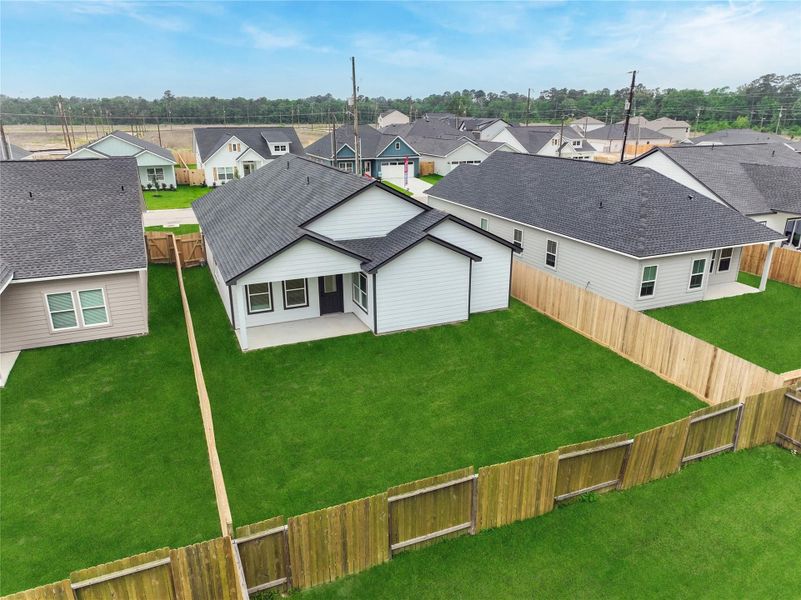 Exterior details and patio area of a home in Hill & Dale Ranch, Splendora (Image 19).