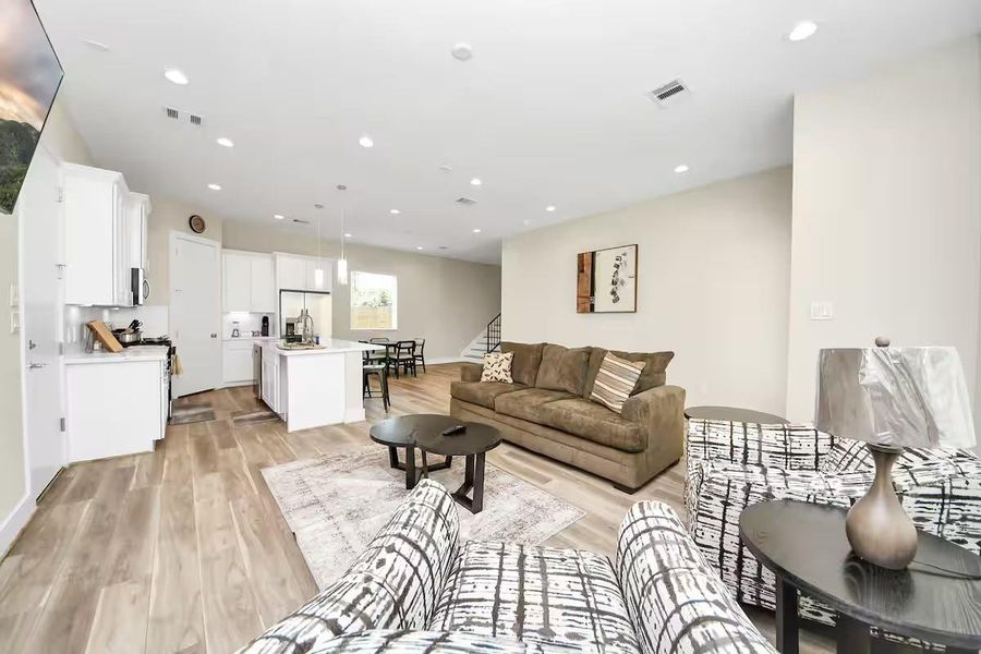 A spacious living area gives you flexibility with furniture placement while keeping the kitchen and dining spaces within easy reach.