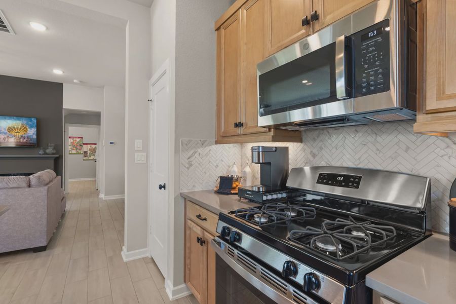 Representative furnished interior of a home built from the Chantilly by Chesmar Homes in The Woodland Hills Chateau, Willis (Image 6).