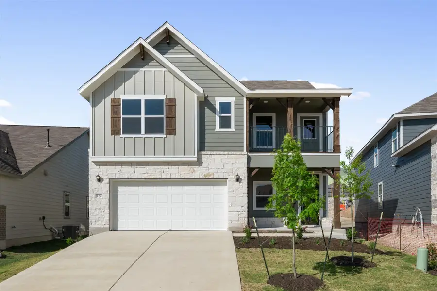 Front exterior of a new home in Rolling Glen, Hutto, TX, highlighting curb appeal (Image 2). Front exterior of a new home in Rolling Glen, Hutto, TX, highlighting curb appeal (Image 2).