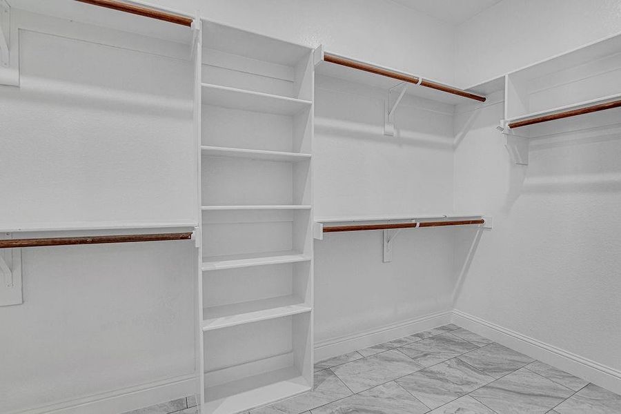 Spacious closet featuring light tile patterned floors