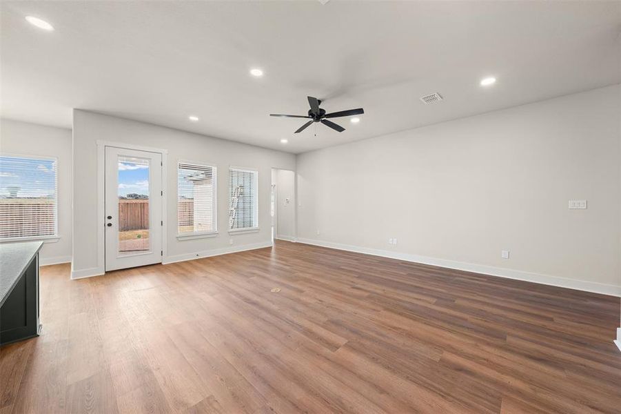 Unfurnished living room with light wood finished floors, recessed lighting, and a ceiling fan