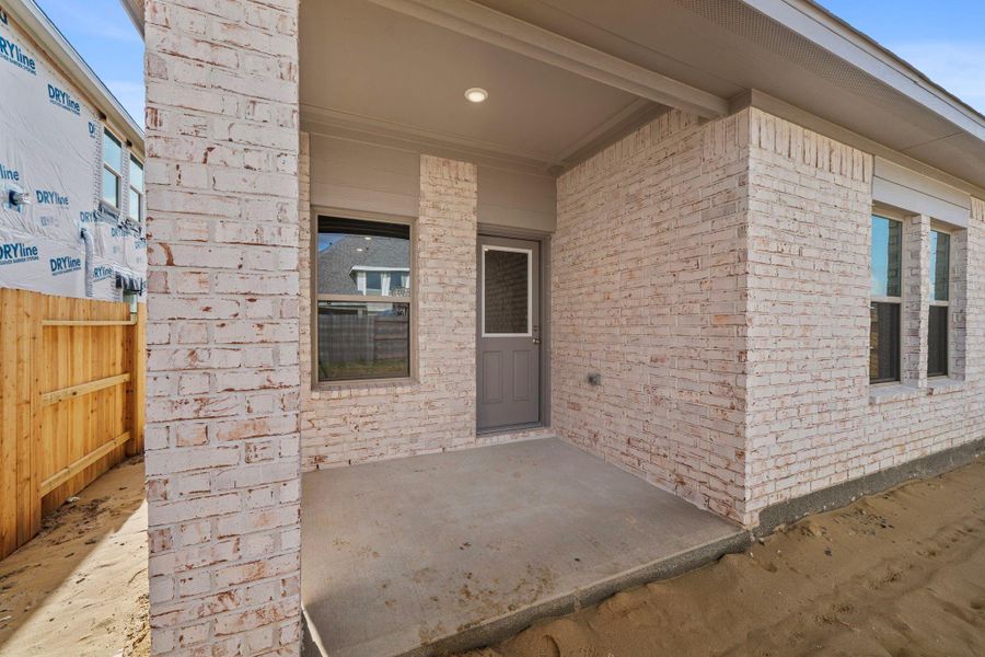 Exterior details and patio area of a home in Windrose Green, Angleton (Image 3).