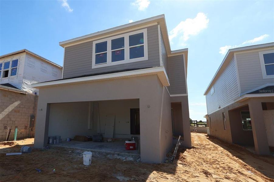 In-progress construction of a new home in Lake Star at Ovation, Winter Garden, FL (Image 13).