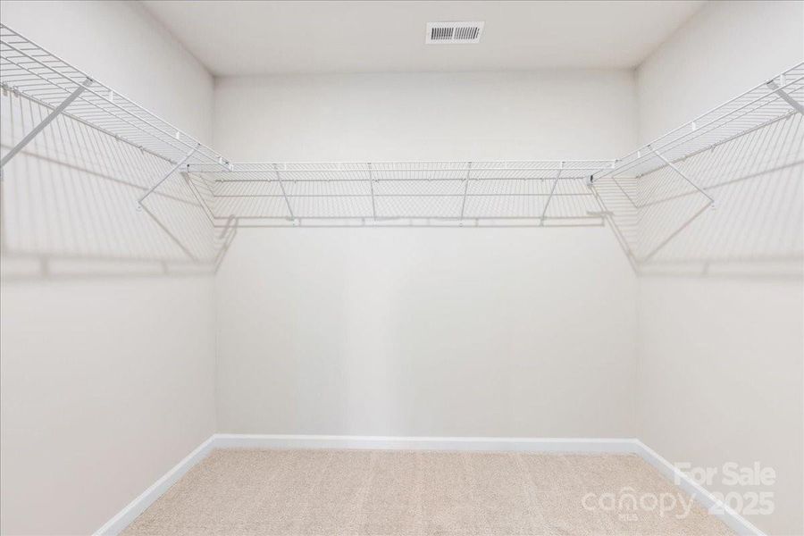 Generously Sized Primary Walk-In Closet.