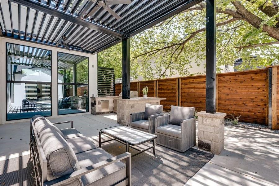 View of patio featuring ceiling fan, outdoor lounge area, and a pergola