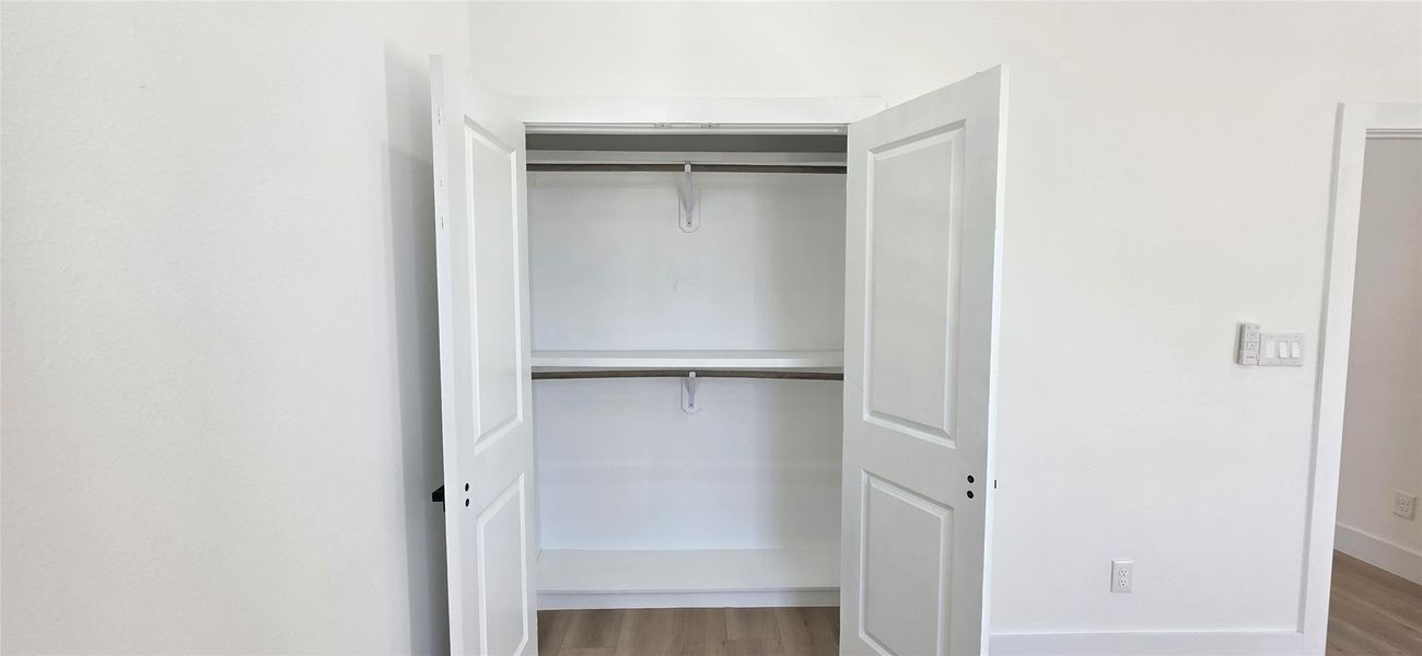 Explore the spacious and airy closet in Bedroom 3, perfect for organizing your wardrobe.