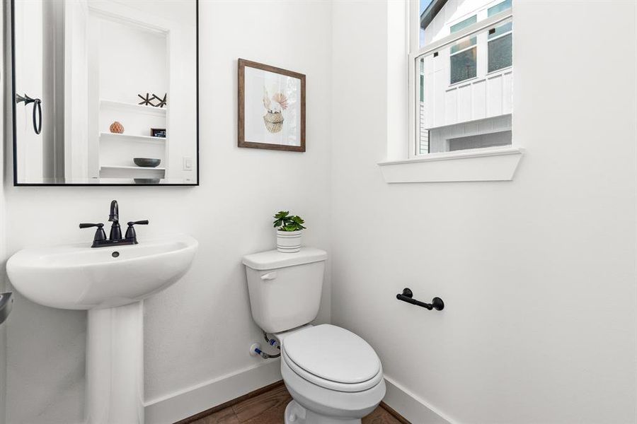 A charming powder bathroom located on the second floor.