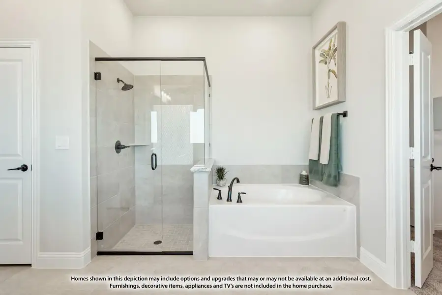 Master bathroom with glass walk-in shower, soaking tub, and gray tile surround