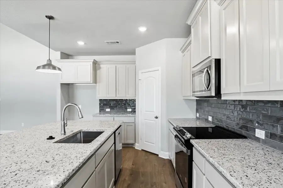 Representative furnished interior of a home built from the The Sapphire Ranch II by Doug Parr Custom Homes in Spring Valley Ranch, Paradise (Image 3).