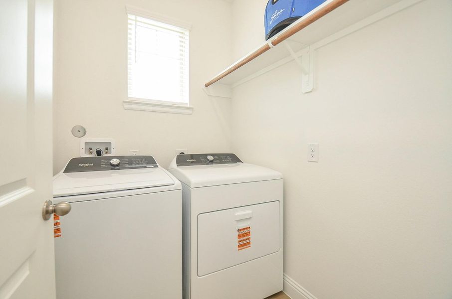 Light and spacious Laundry room comes equipped with Washer/Dryer