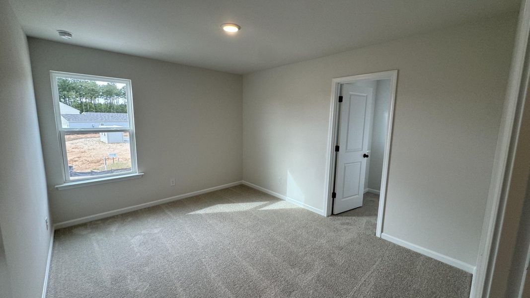 Spacious, unfurnished interior of a new home in Watson Hill, Summerville (Image 43).