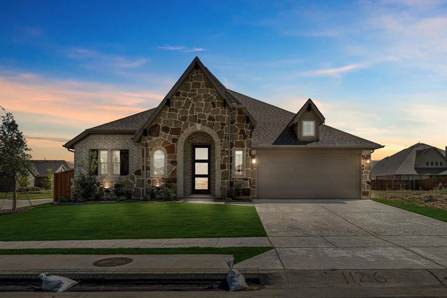 Front exterior of a new home in Timberbrook 3B-4A, Justin, TX, highlighting curb appeal (Image 1).