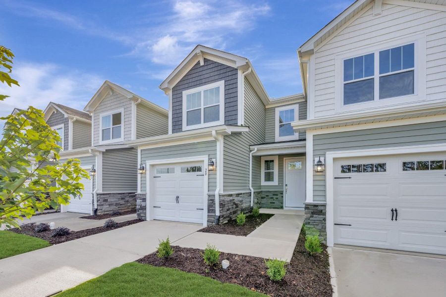 Front exterior of a new home in Powell, Angier, NC, highlighting curb appeal (Image 20).