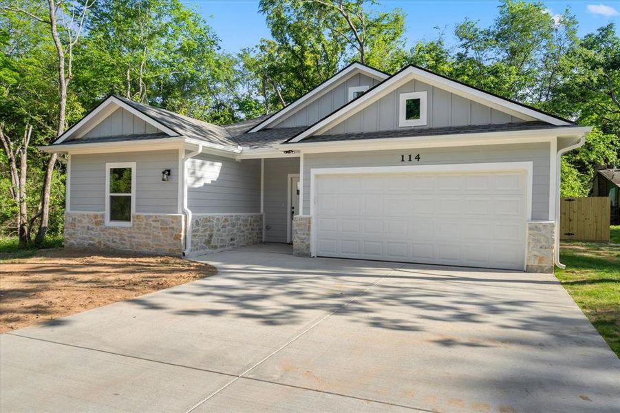 Front exterior of a new home in , Payne Springs, TX, highlighting curb appeal (Image 18). Front exterior of a new home in , Payne Springs, TX, highlighting curb appeal (Image 18).