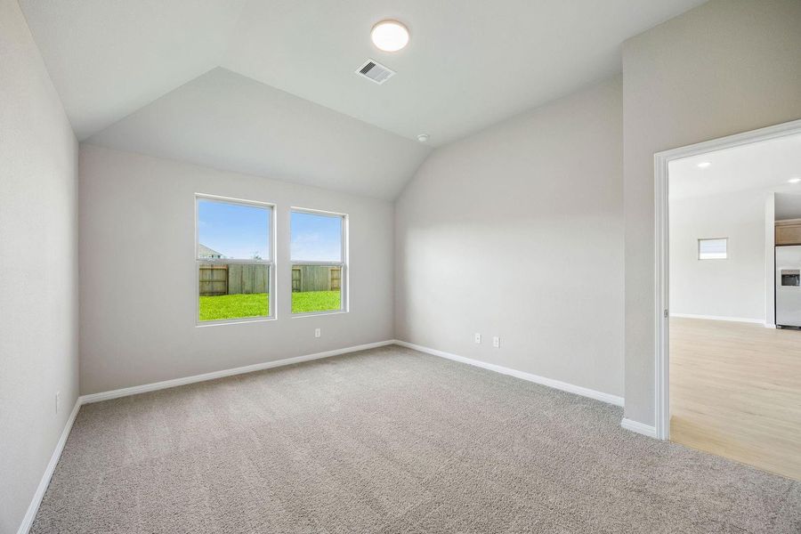 Primary Bedroom in the Sabine home plan by Trophy Signature Homes – REPRESENTATIVE PHOTO