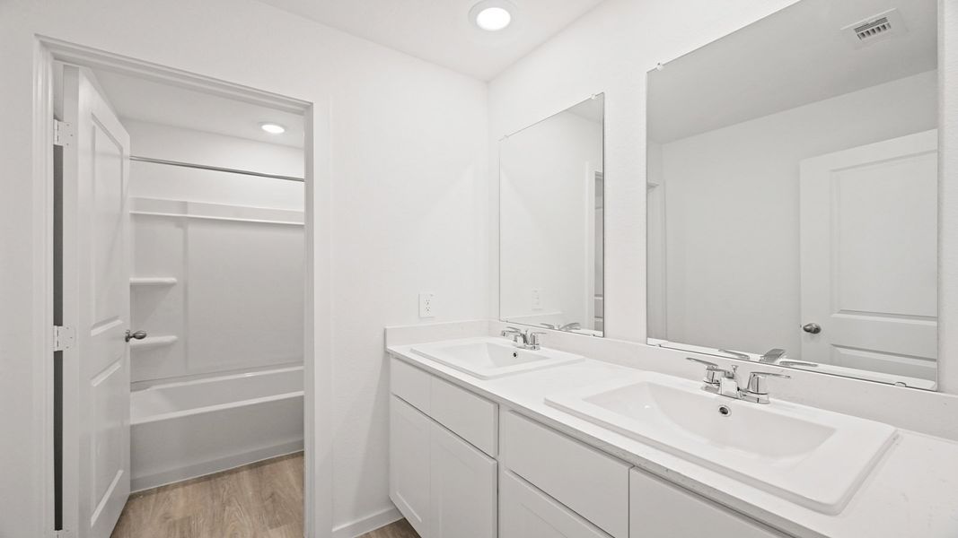 Representative furnished interior of a home built from the Carson by D.R. Horton in Lexington Heights, Willis (Image 7).