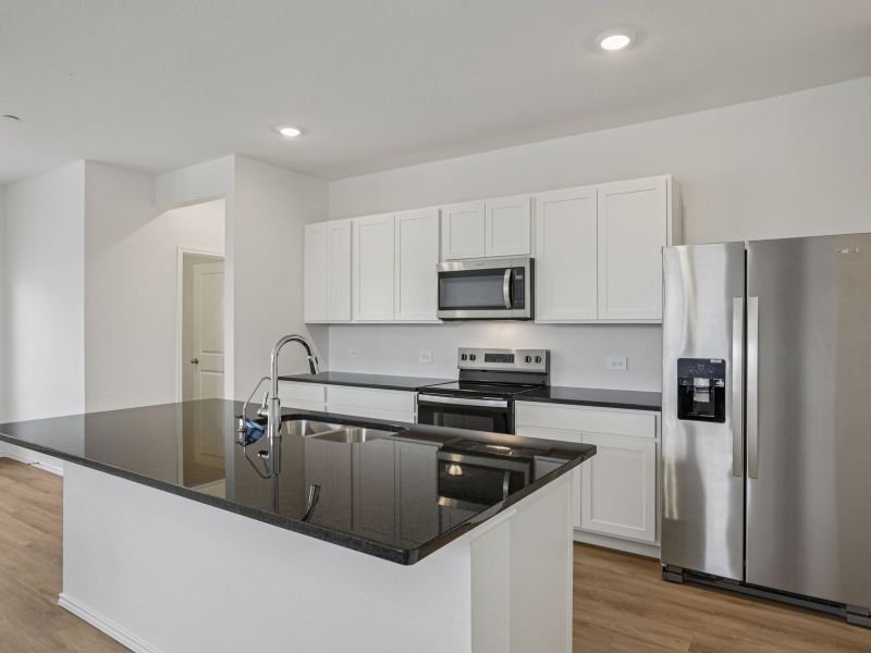 Furnished interior view inside a new home in Turner's Village, Buda (Image 3).
