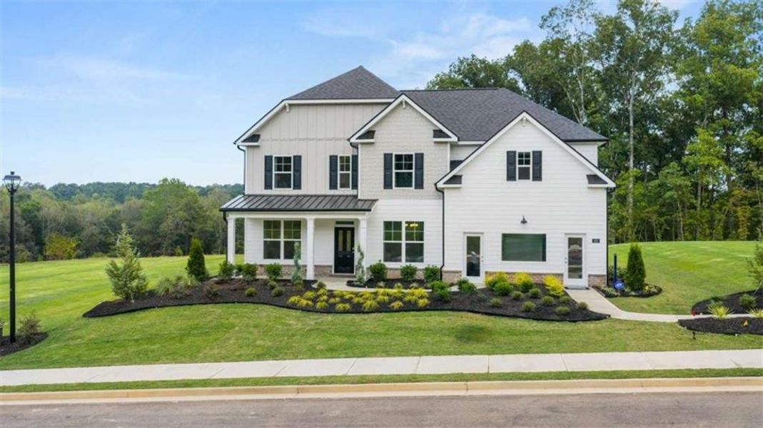 Front exterior of a new home in Heritage Pointe, Senoia, GA, highlighting curb appeal (Image 1). Front exterior of a new home in Heritage Pointe, Senoia, GA, highlighting curb appeal (Image 1).