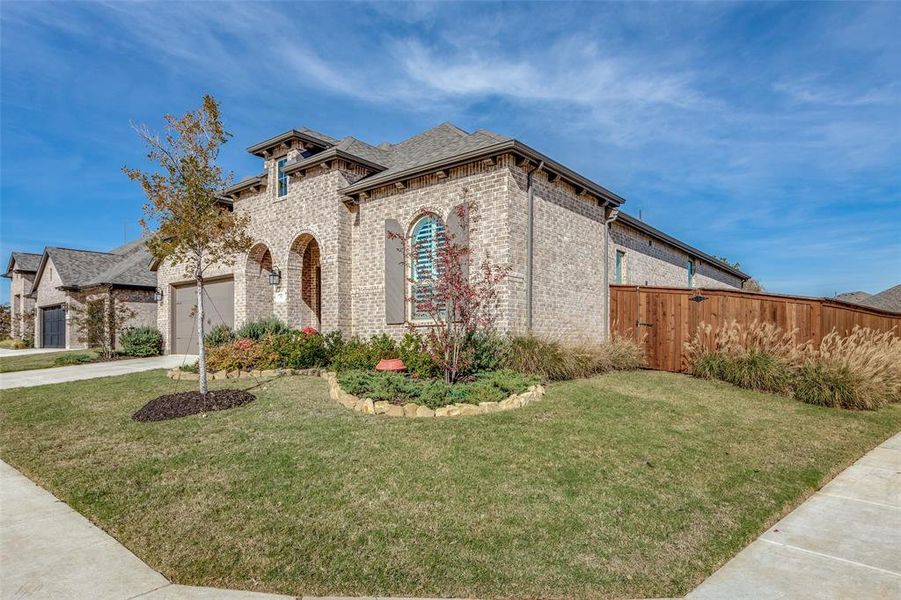 Front exterior of a new home in Wildridge, Oak Point, TX, highlighting curb appeal (Image 19). Front exterior of a new home in Wildridge, Oak Point, TX, highlighting curb appeal (Image 19).