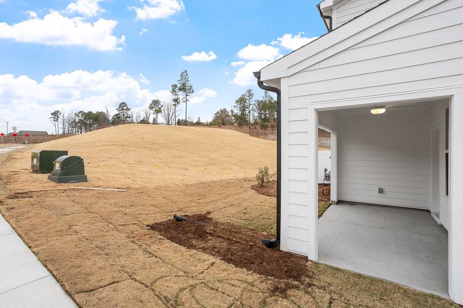 Exterior details and patio area of a home in Ovation at Sweetbrier, Durham (Image 3).