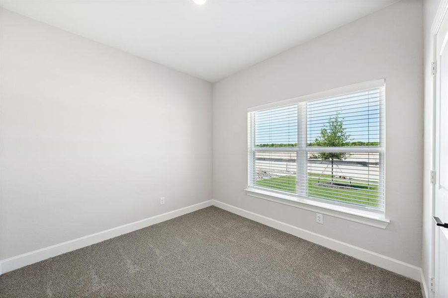 Spare room featuring carpet floors