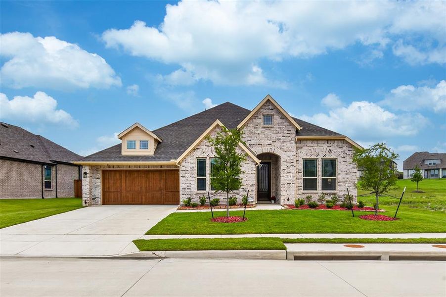 Front exterior of a new home in , Forney, TX, highlighting curb appeal (Image 1). Front exterior of a new home in , Forney, TX, highlighting curb appeal (Image 1).