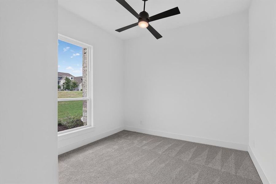 Room featuring a single-pane window, neutral carpet flooring, white walls, and a ceiling fan with integrated lighting Room featuring a single-pane window, neutral carpet flooring, white walls, and a ceiling fan with integrated lighting