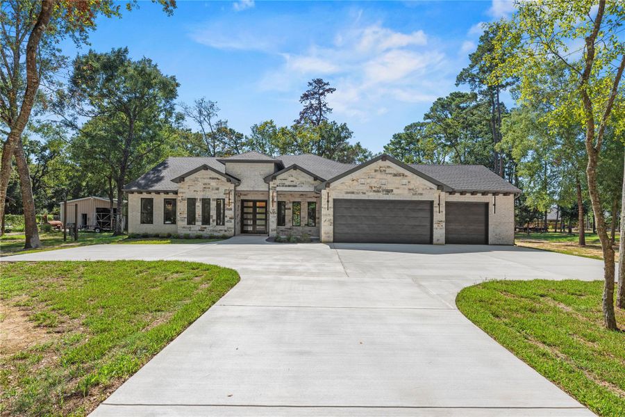 Front exterior of a new home in , Magnolia, TX, highlighting curb appeal (Image 27). Front exterior of a new home in , Magnolia, TX, highlighting curb appeal (Image 27).
