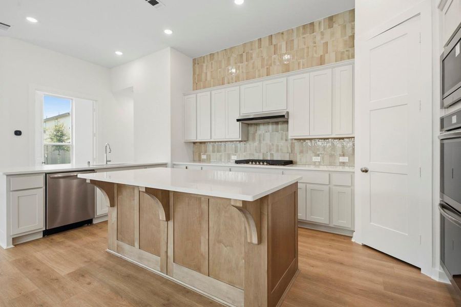 Two tone kitchen cabinets with warmer colors Two tone kitchen cabinets with warmer colors