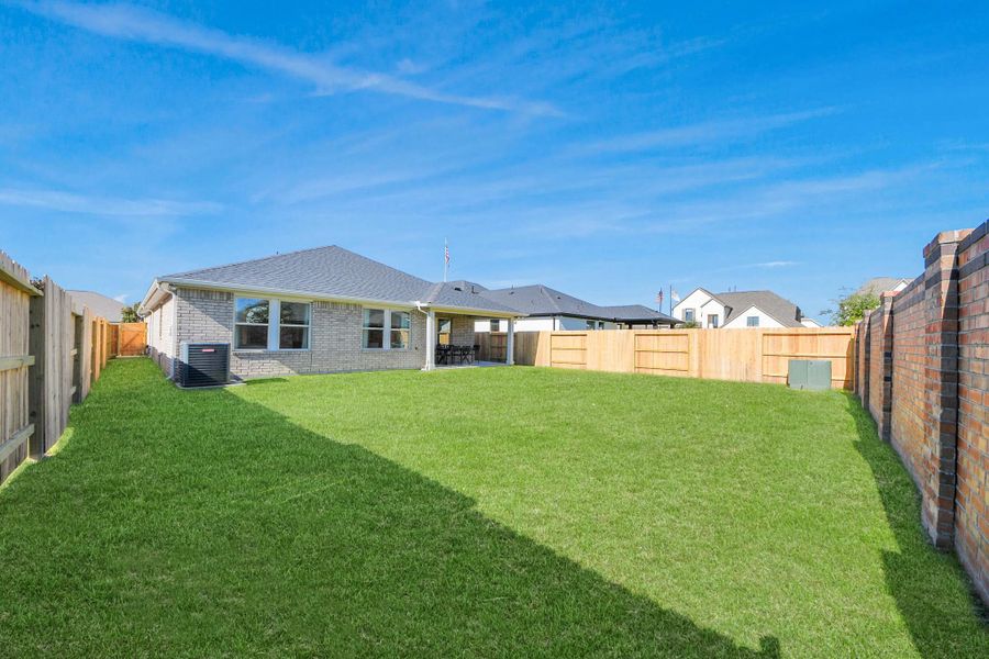 Exterior details and patio area of a home in Sunterra: Landmark Collection, Katy (Image 23).