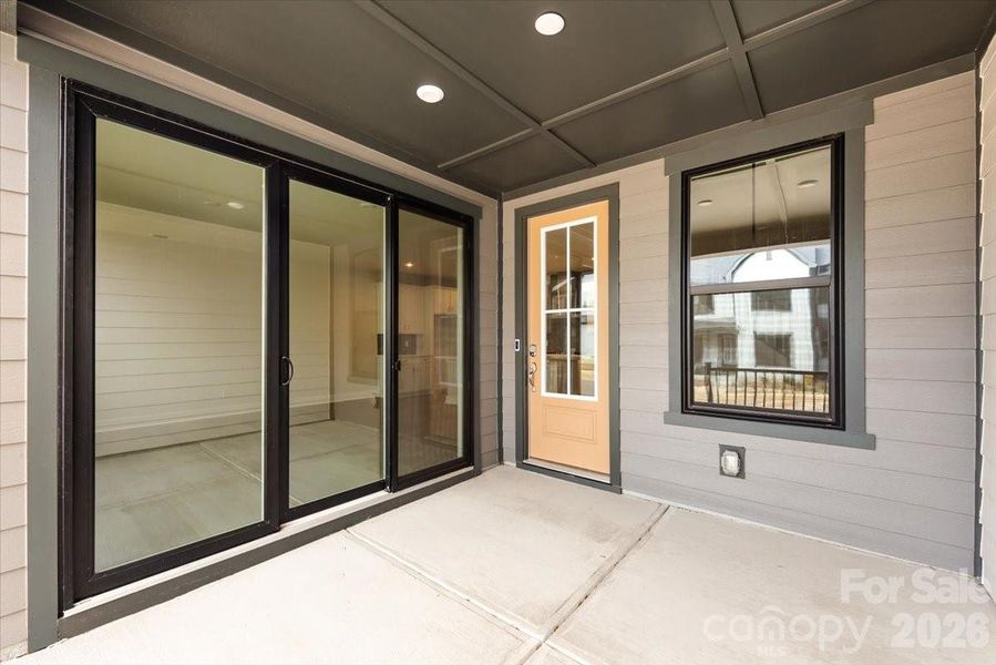 Covered Front Porch with Sliding Glass Doors from the Living Room