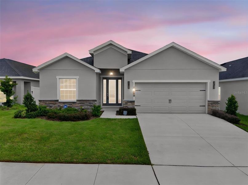 Front exterior of a new home in , Davenport, FL, highlighting curb appeal (Image 27).