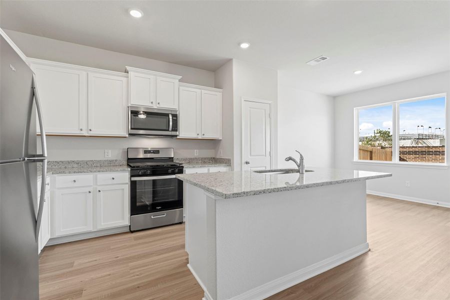 Furnished interior view inside a new home in Canterra Creek, Iowa Colony (Image 5).