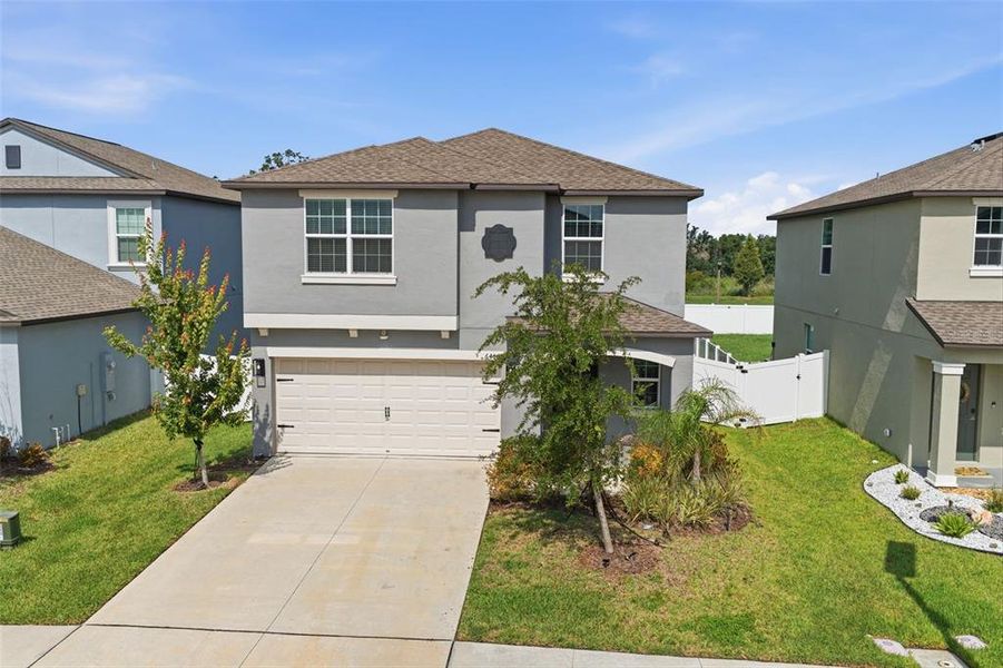 Front exterior of a new home in , Zephyrhills, FL, highlighting curb appeal (Image 30).