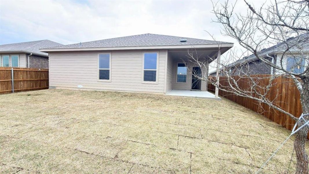 Exterior details and patio area of a home in Bluestem, Rhome (Image 2).